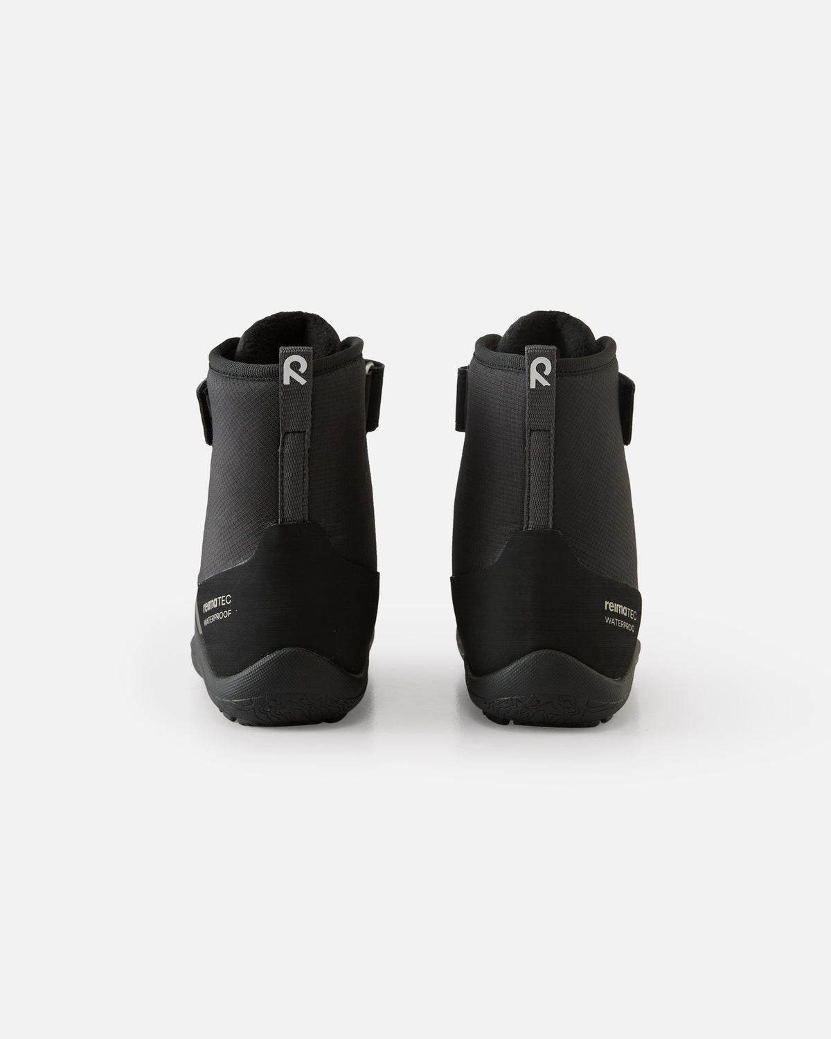 Støvlepar set bagfra med hælstropper og ReimaTec Waterproof-mærke på hælkappen