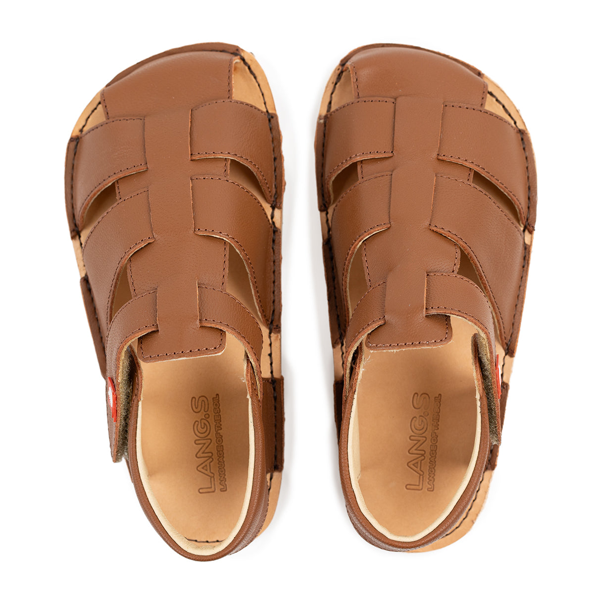 Top view of Tikki Lasta Leather sandals, variante Bruno, for børn. Unisex design with brown læderstraps og synlig syning, velegnet til barfodsgang.