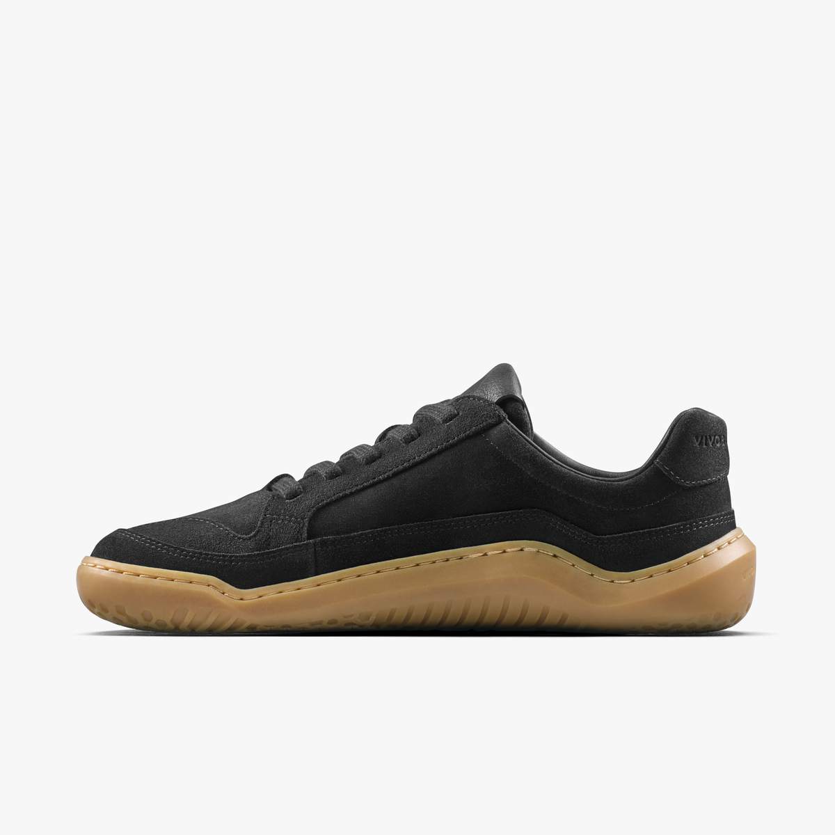 Sort lædersneaker med lys gummisål set fra indersiden