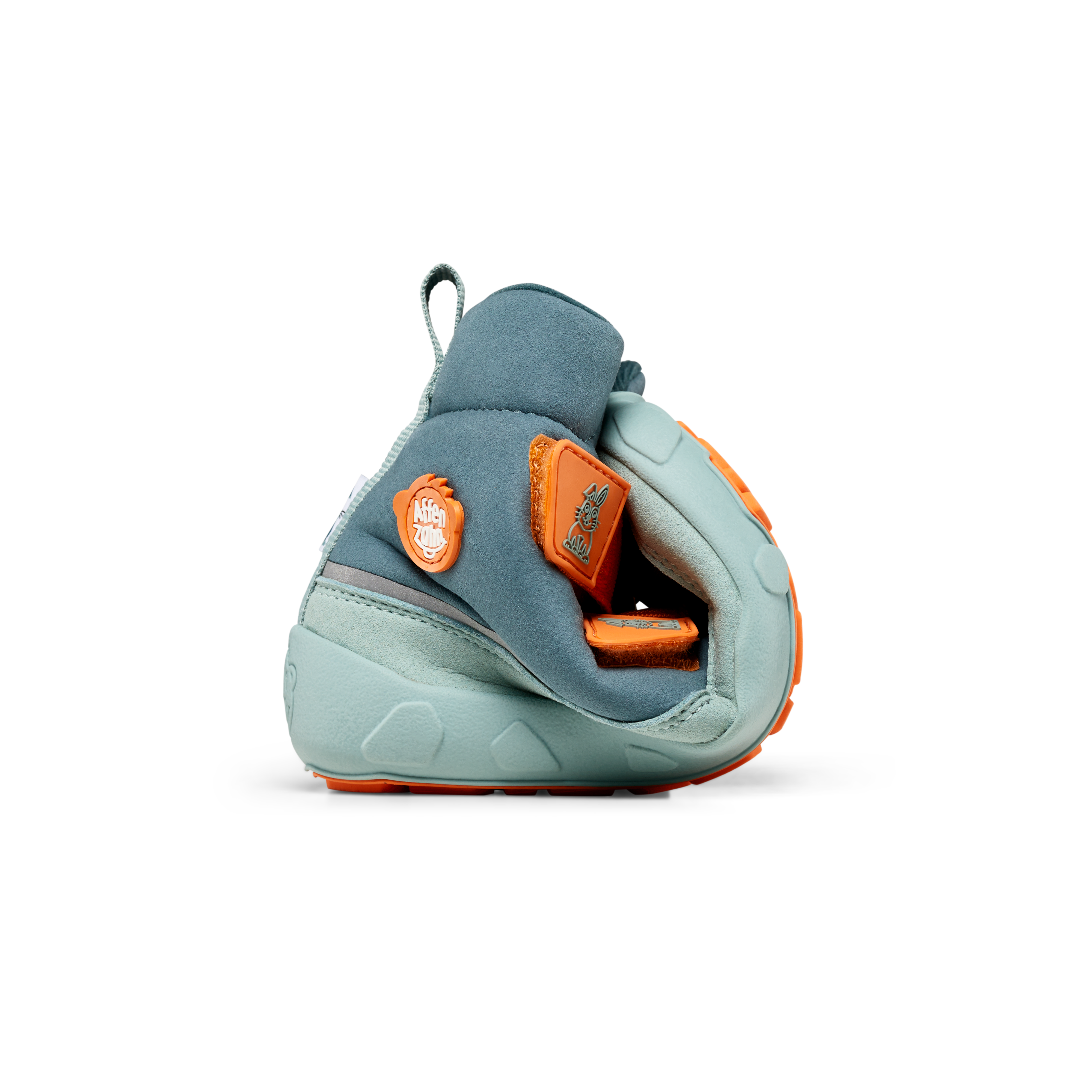 Affenzahn Winter Boot Vegan Comfy, Rabbit variant for kids, shown rolled to highlight flexibility. Light blue with orange accents, emphasizing eco-friendly, comfortable design.