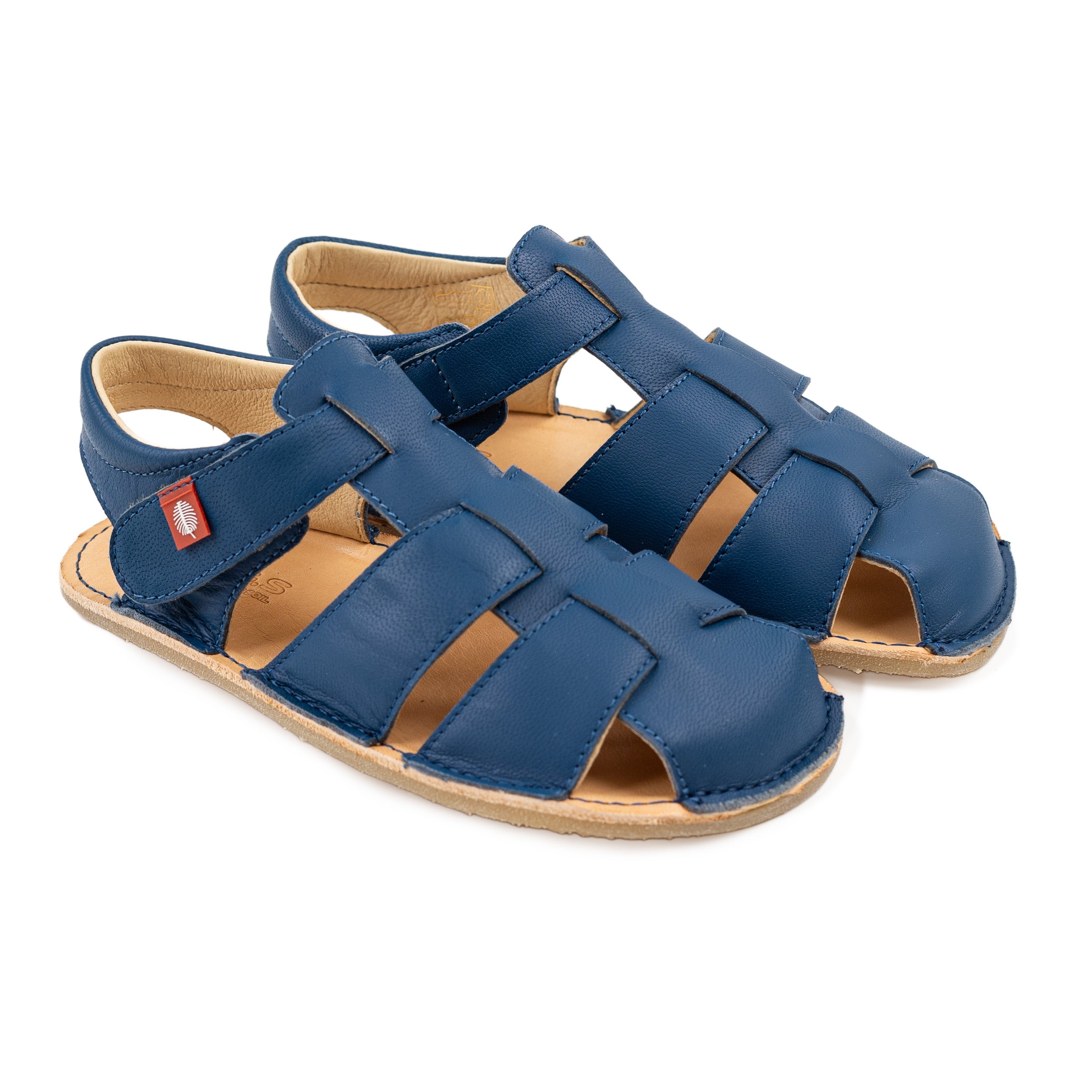 Blå Tikki Lasta Leather sandaler til børn i Mare-varianten, med åben tå og justerbare stropper. Barfodsstil med naturlæder sål, velegnet til fleksibel bevægelse.