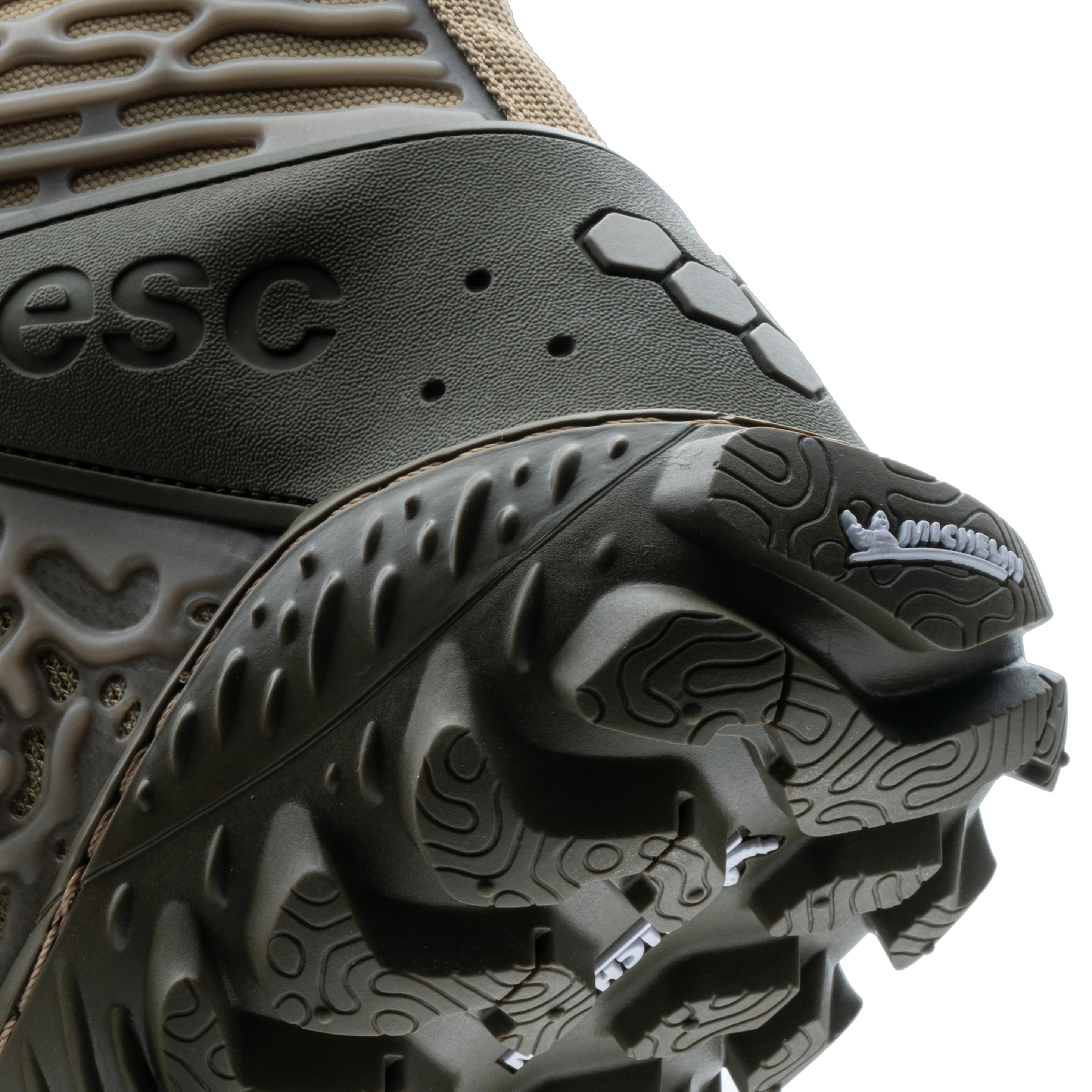 Tæt på Vivobarefoot Jungle ESC herremodellen med synlig ESC-logo og robust, mørkegrå ydersål designet til friluftsliv i varianten Invisible.