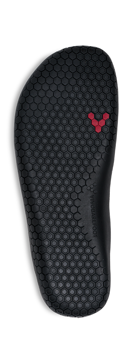 Sål af Vivobarefoot Primus Lite Knit Womens i varianten Obsidian Iridescent, udformet til barfodssko. Fremstår i sort med hexagonalt mønster og rødt logo.