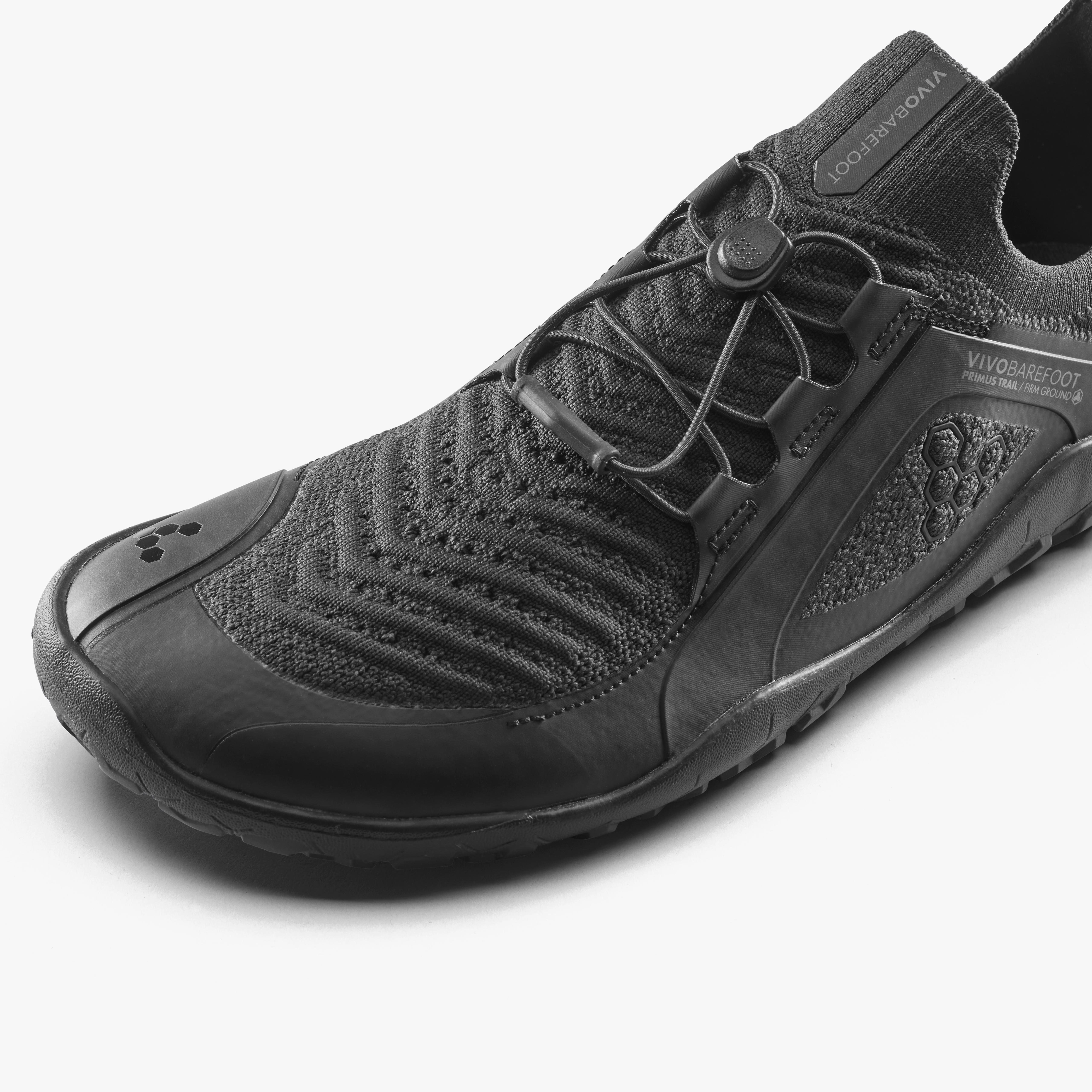 Vivobarefoot Primus Trail Knit FG Grounding Mens barfodssko til mænd i farven obsidian, nærbillede