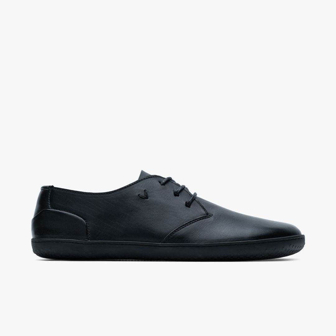 Vivobarefoot Ra III Lux Mens sko i Obsidian med glat, metal-frit læder og lav profil. Sidevisning af sort barefoot sko med enkel snørebånd og minimalistisk design.